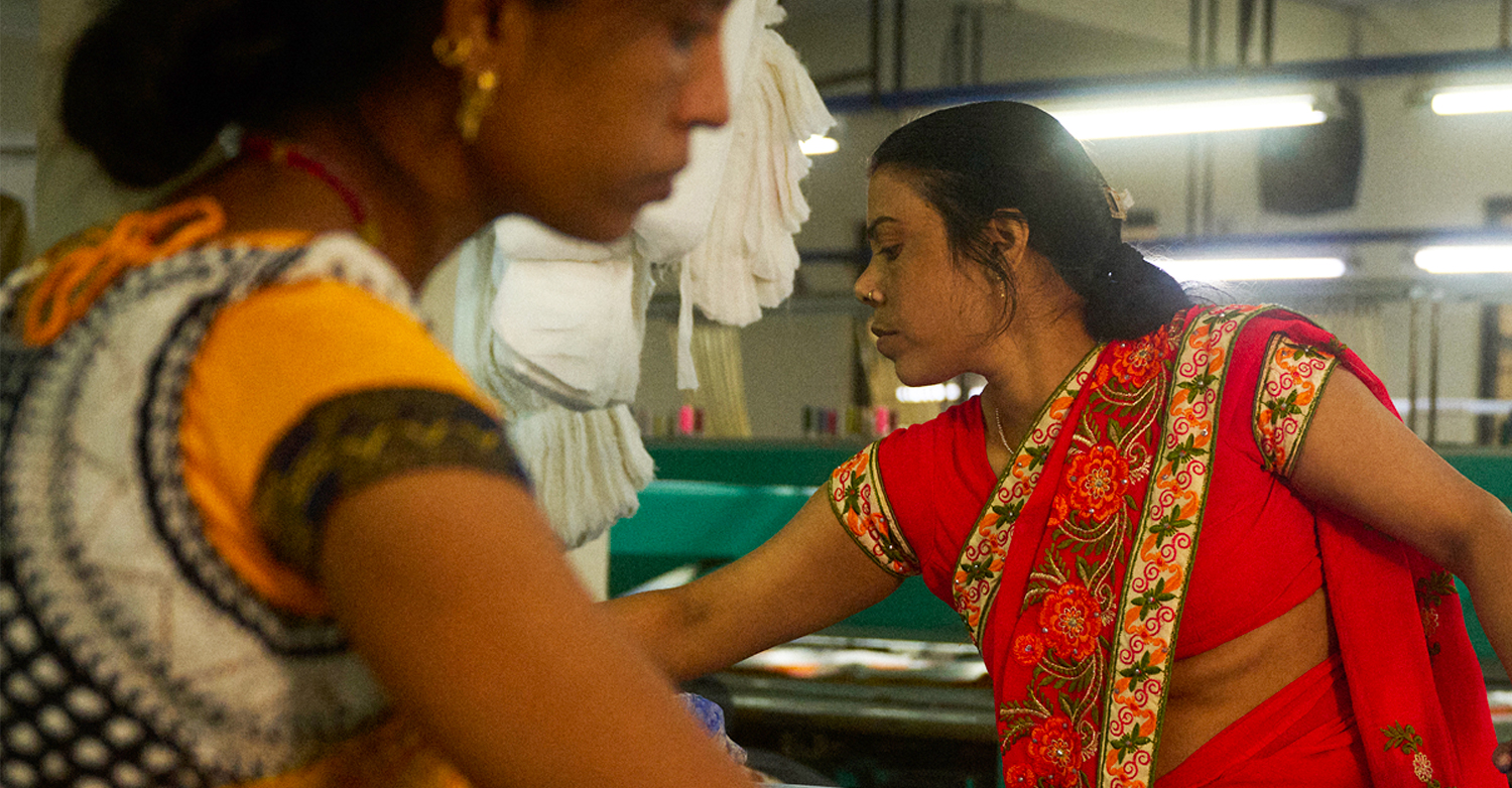 Two women wearing vibrant clothing 