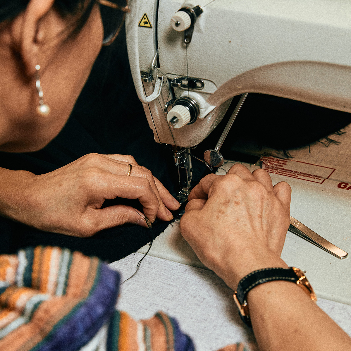 Seamstress working on a sewing machine