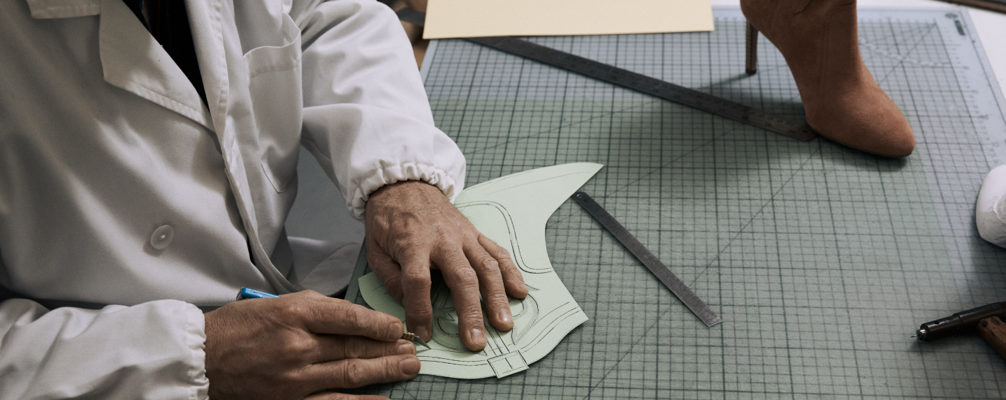 Designer sketching the caitlin boots