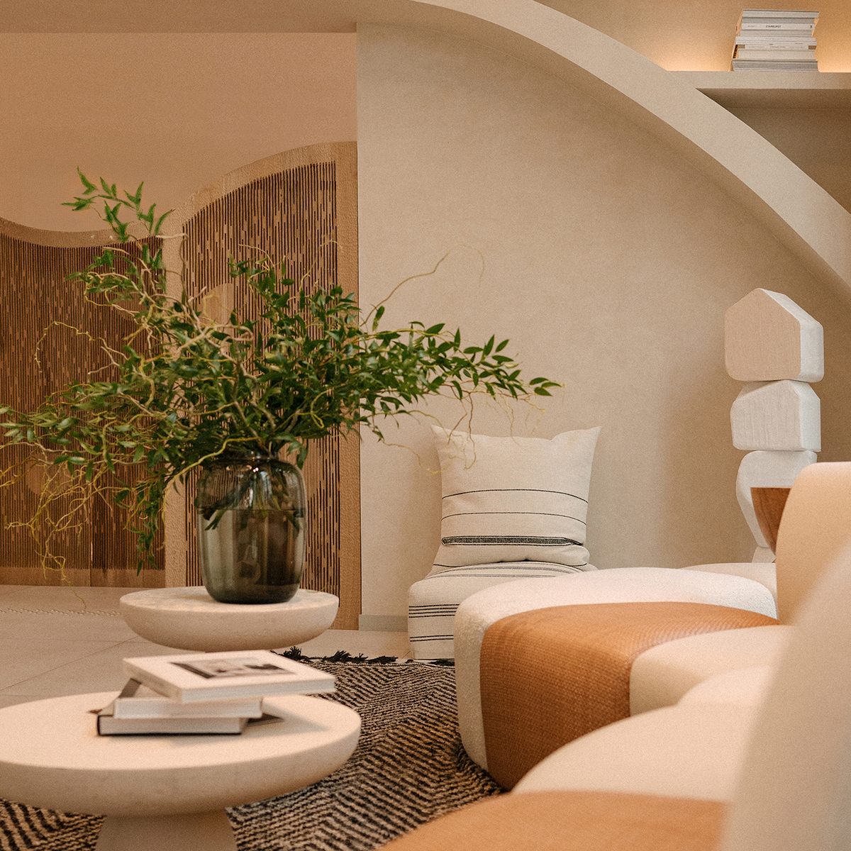 The entrance to ba&sh with a plant and white sofas