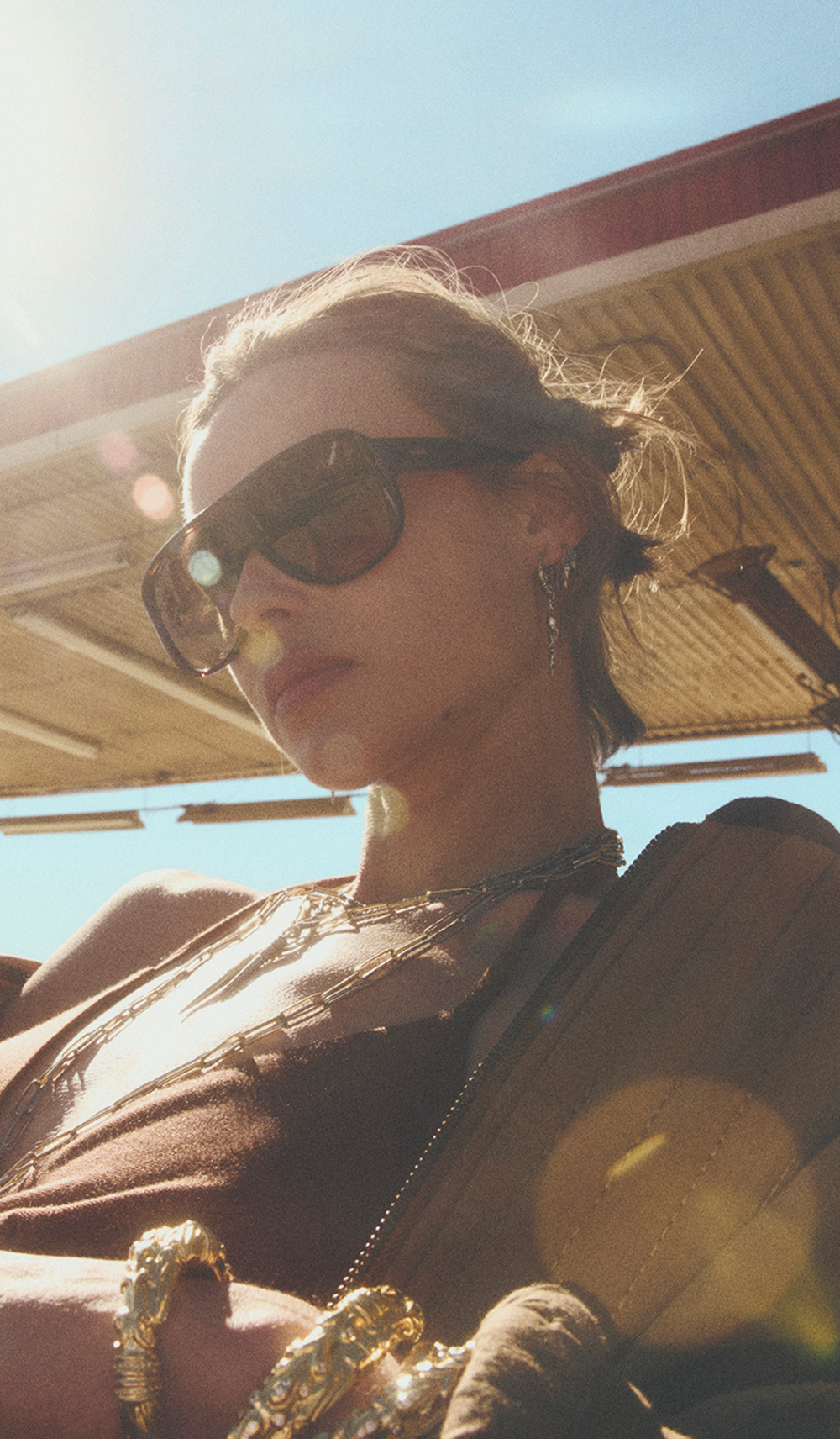 A model wearing brown sunglasses
